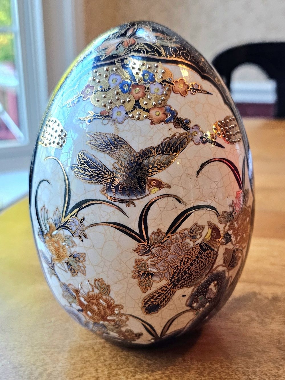 Hand-Painted Satsuma Porcelain Egg Figurine with Gold Bird Motif